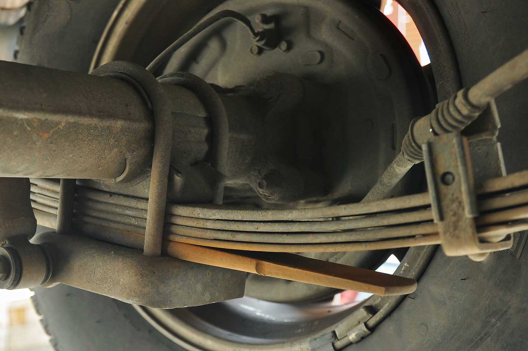 The leaf spring suspension of a truck.